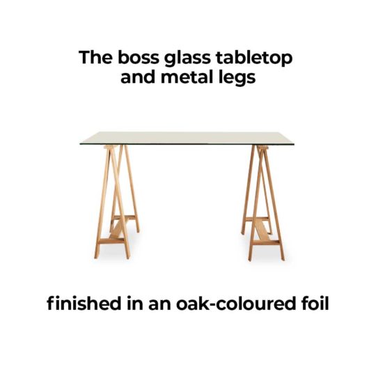 Waverley Trestle Desk, is a boss glass tabletop and metal legs finished in an oak-coloured foil.