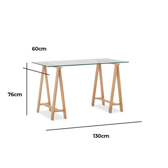 Waverley Trestle Desk, is a boss glass tabletop and metal legs finished in an oak-coloured foil.